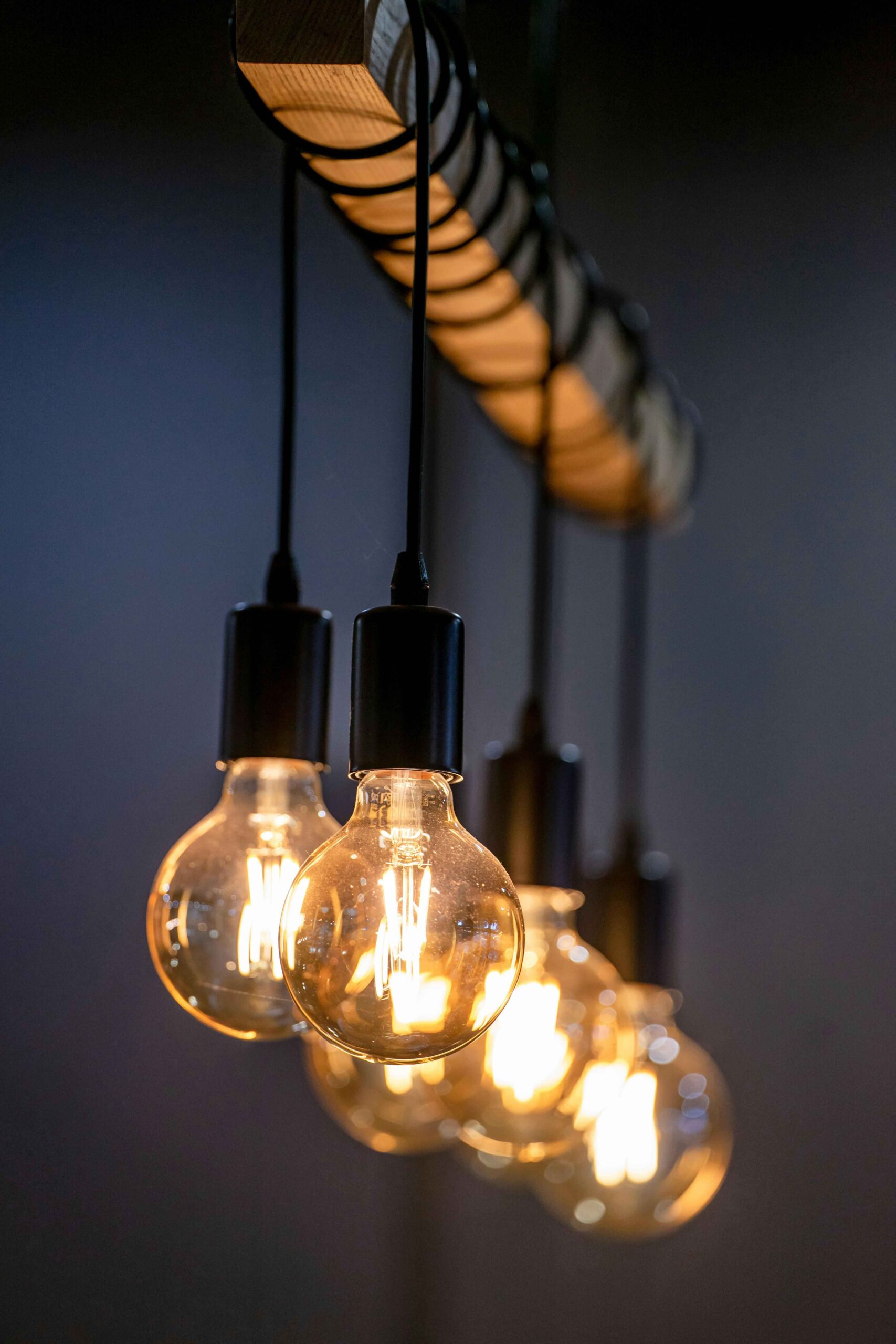 Elegant warm-toned LED filament bulbs create a cozy and inviting atmosphere, perfect for modern lighting designs.