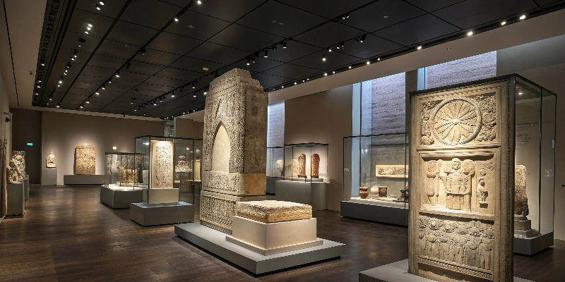 Museum lighting Ancient sculptures in a museum gallery, illuminated by LED lights