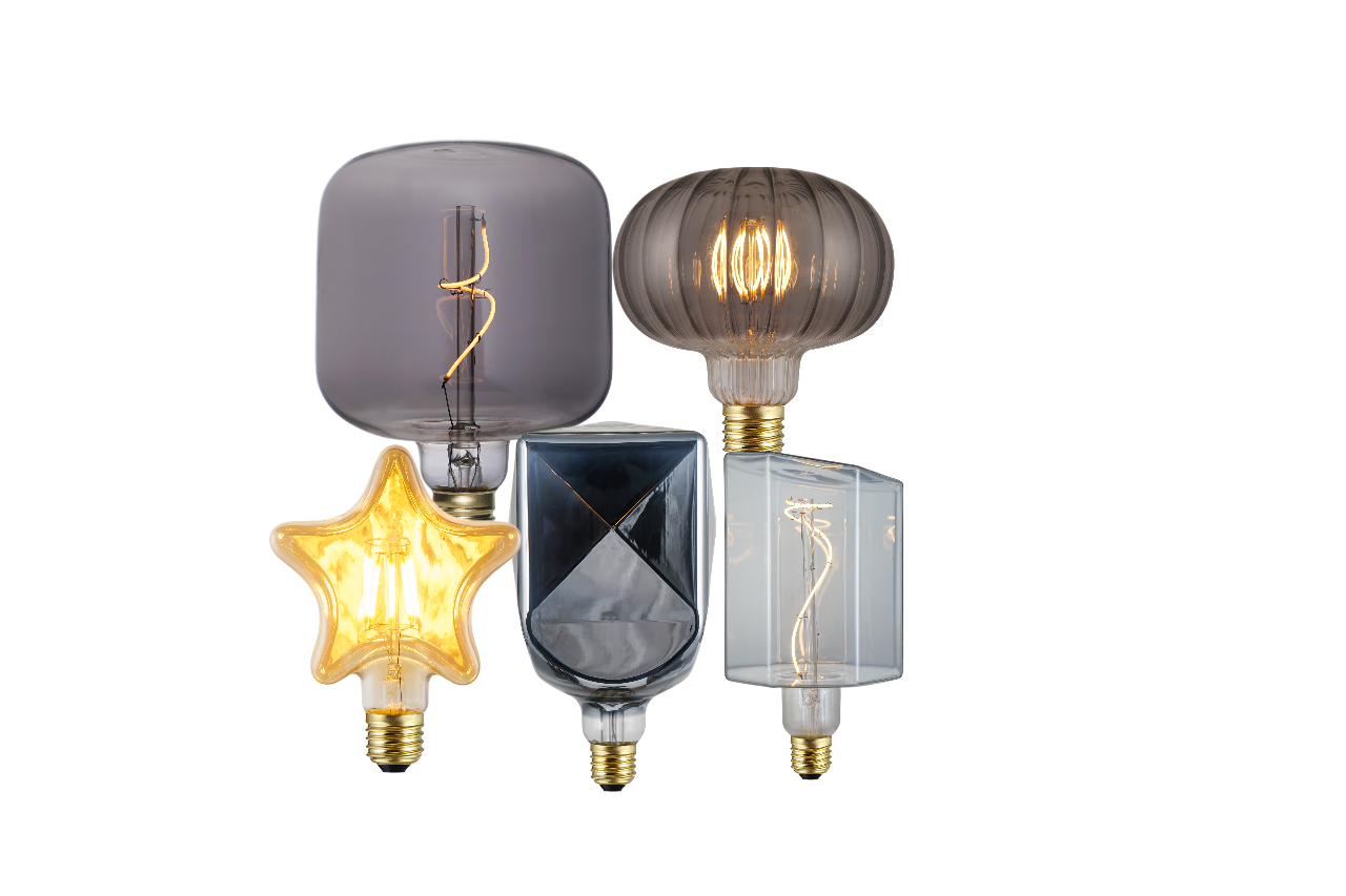Custom-shaped LED filament bulbs in unique geometric and artistic glass designs, including star, square, and oval shapes, ideal for decorative lighting and premium interior projects