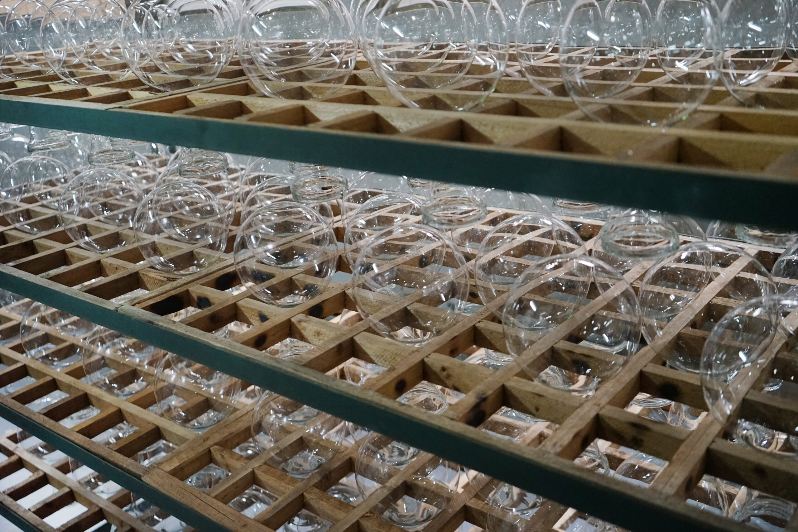 Automated production line manufacturing soda-lime glass LED filament bulbs in a Chinese factory