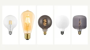 Clear, amber, smoky, porcelain and sculpted decorative LED bulbs shown side by side