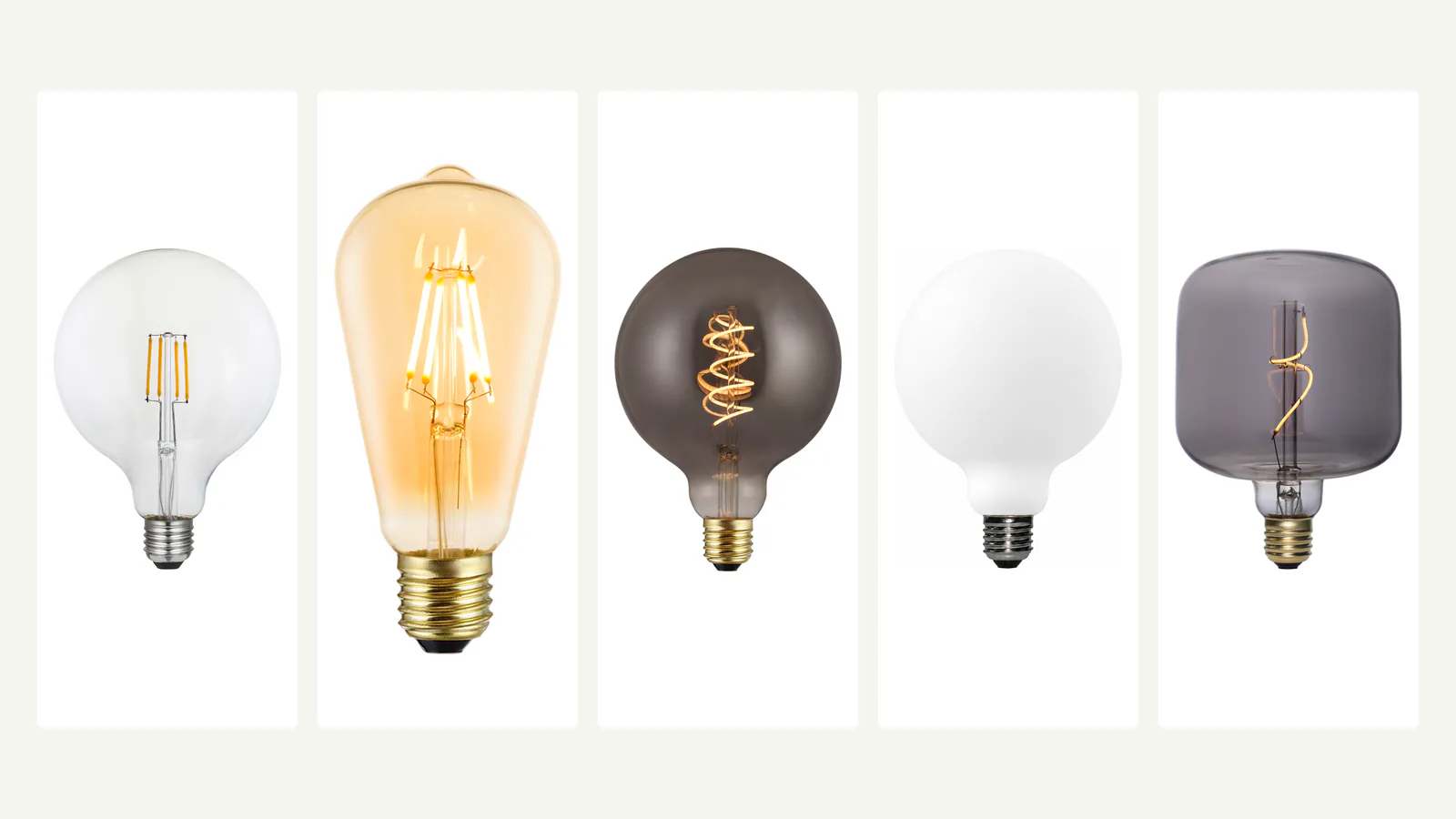 Clear, amber, smoky, porcelain and sculpted decorative LED bulbs shown side by side