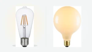 Clear filament ST64 bulb compared side by side with a glowing opal globe bulb