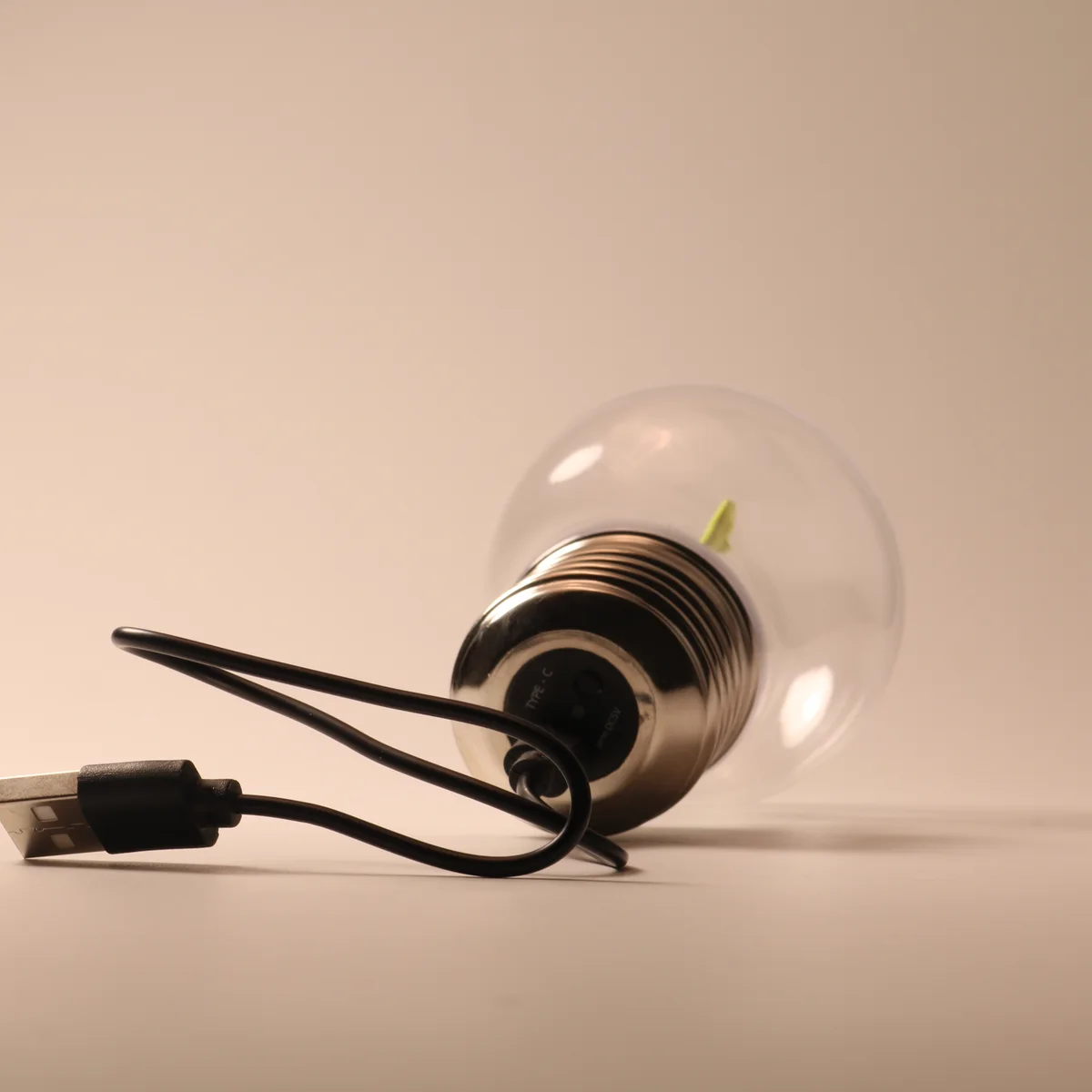 Actual rechargeable lamp base showing the USB-C charging connection and button
